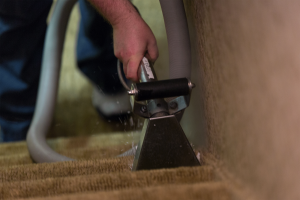 Cleaning carpet on stairs